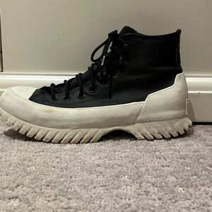 Converse Black and White High-Top Sneakers. Leather. Counter climate